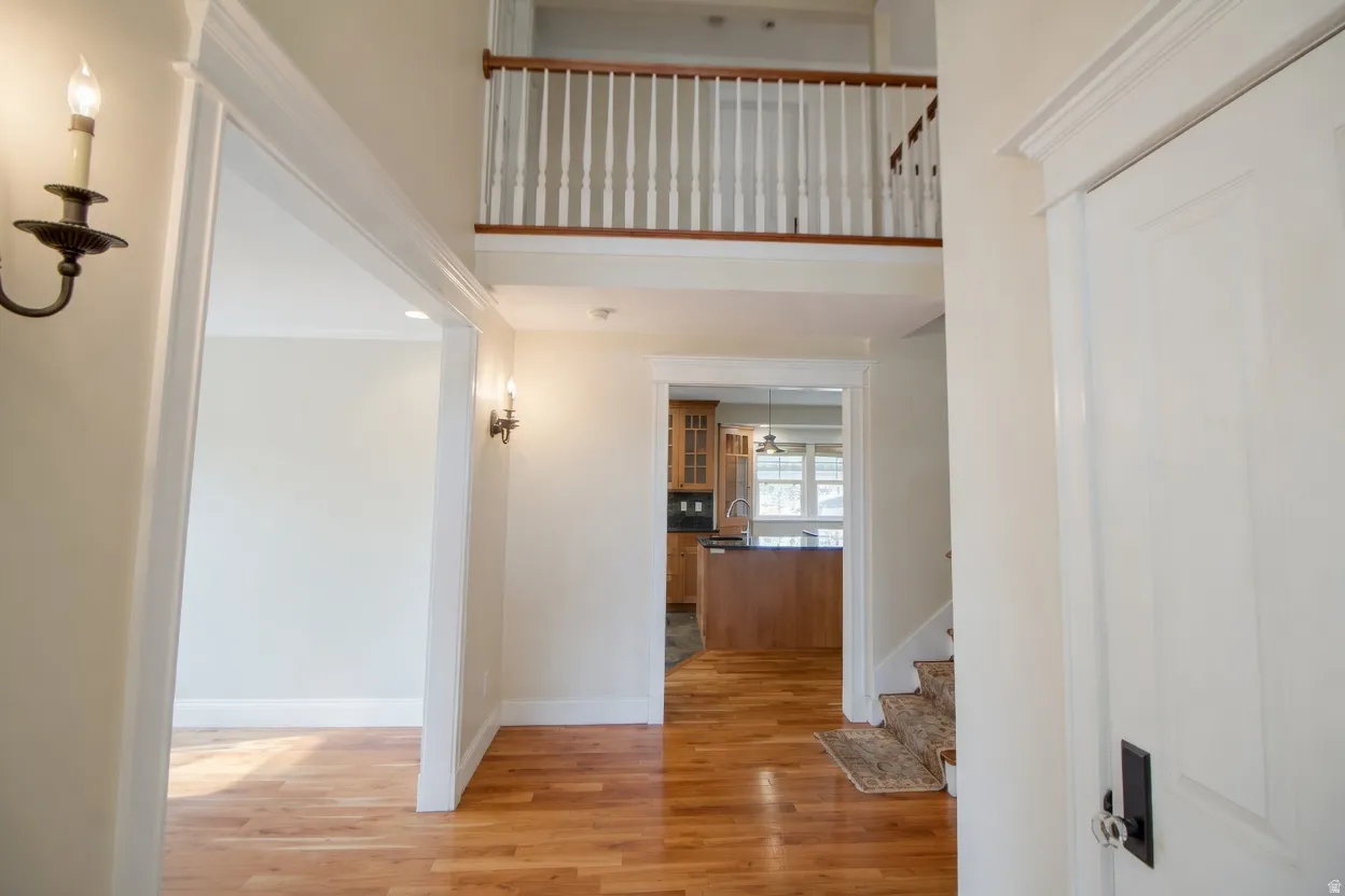 Two-story foyer with wood-finish flooring