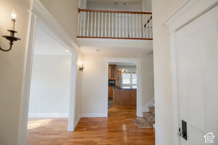 Two-story foyer with wood-finish flooring
