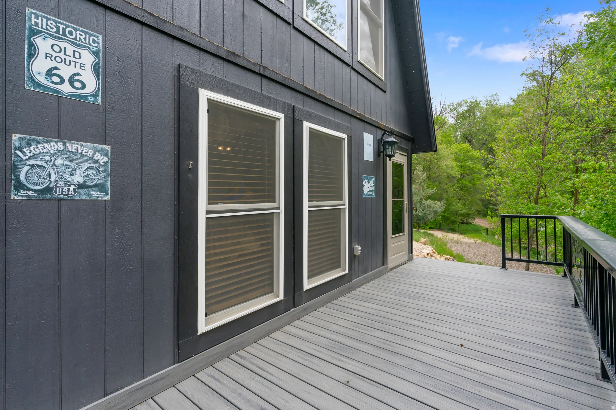 Expansive outdoor deck featuring composite decking and black metal railings