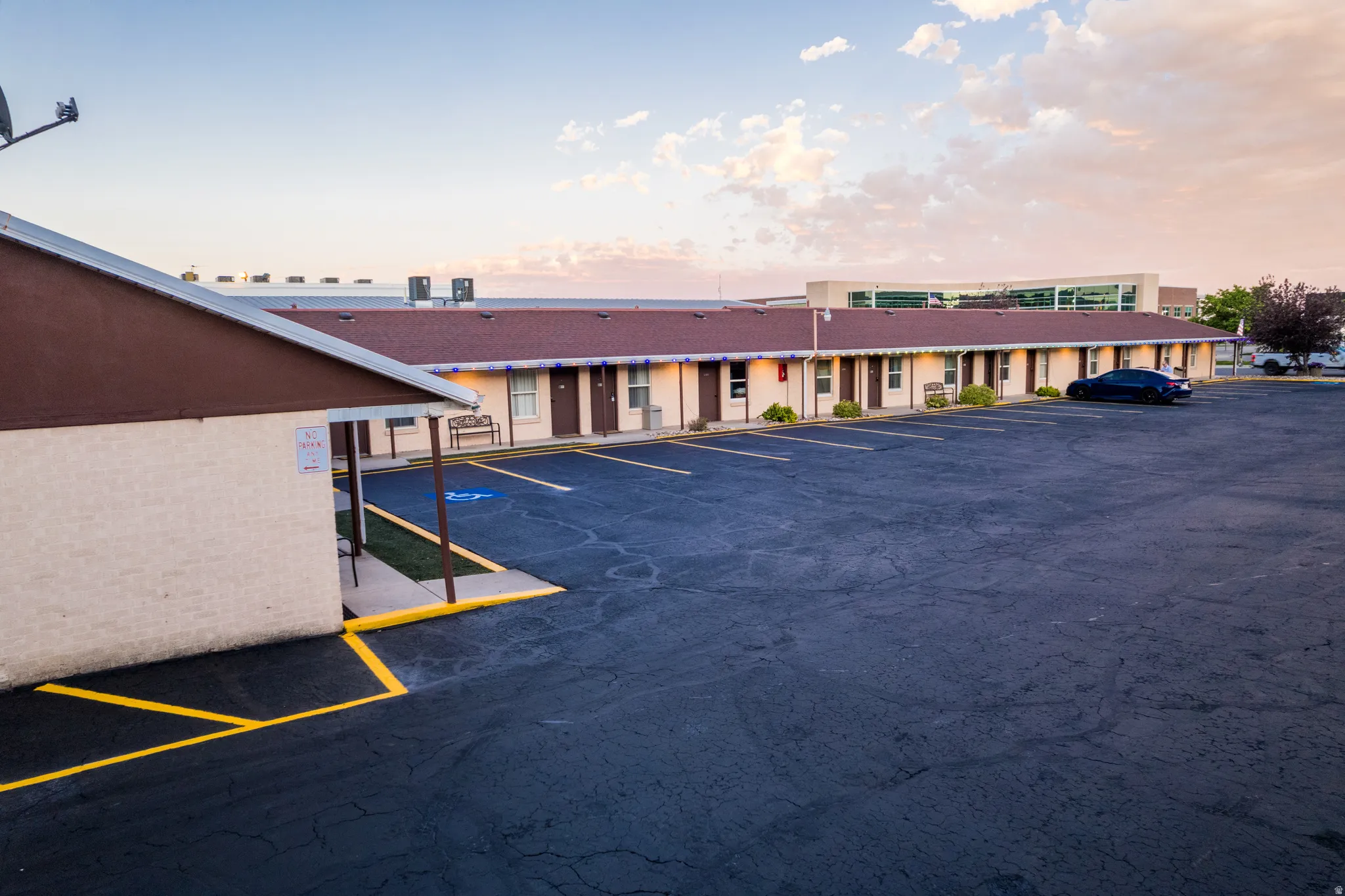 Extensive paved parking area with yellow line markings