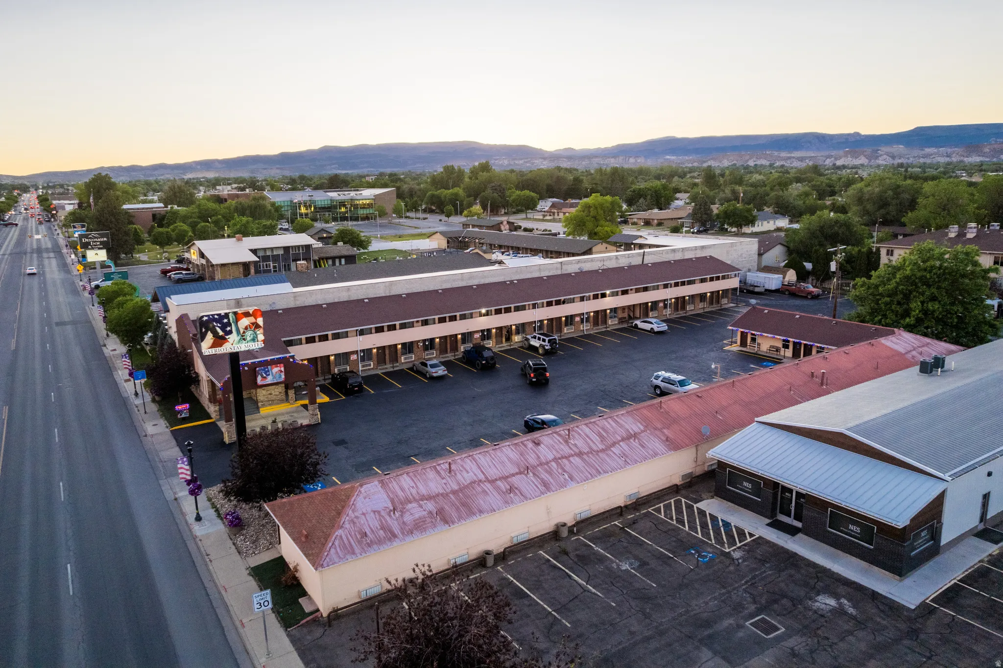 Expansive commercial property featuring multiple structures and surface parking