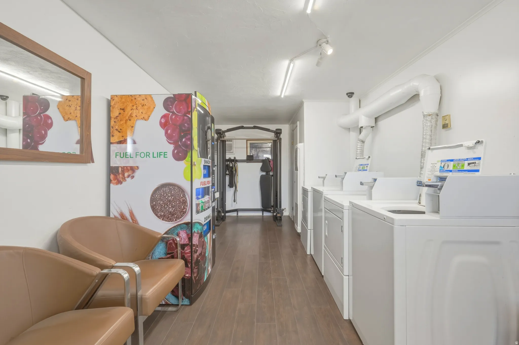 Dedicated laundry facility featuring multiple front-loading and top-loading machines