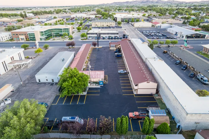 Aerial perspective showcasing multiple commercial structures and ample parking