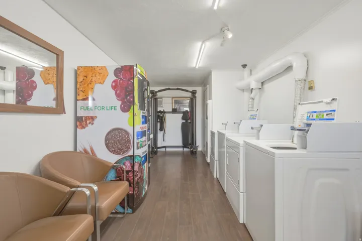 Dedicated laundry facility featuring multiple front-loading and top-loading machines