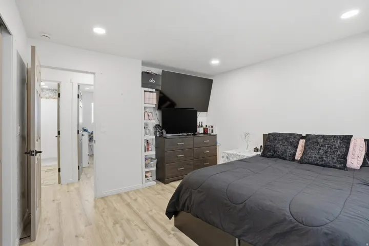Room featuring light wood-finish flooring and white walls