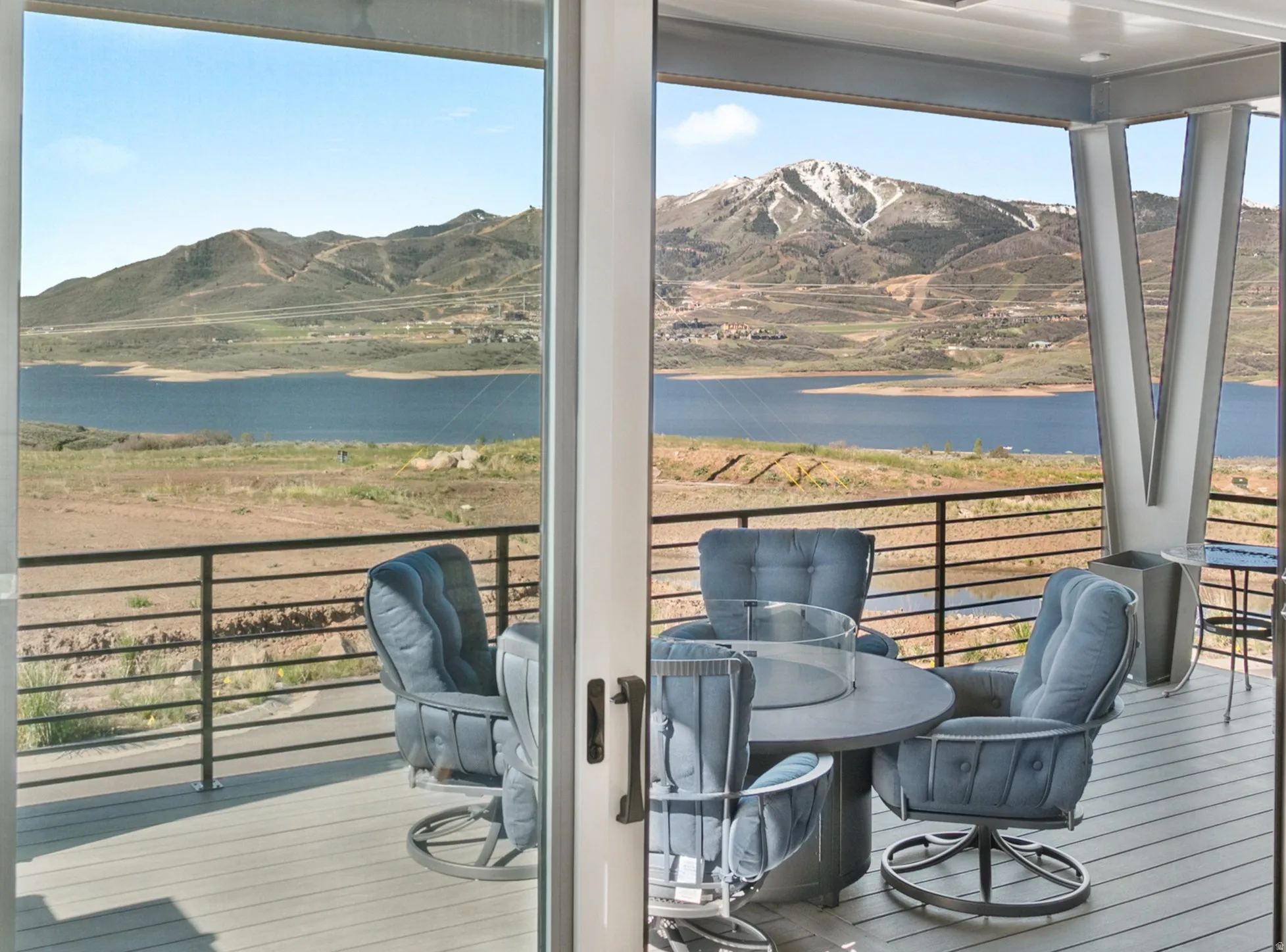 Expansive outdoor deck featuring a composite wood-finish surface and cable railing