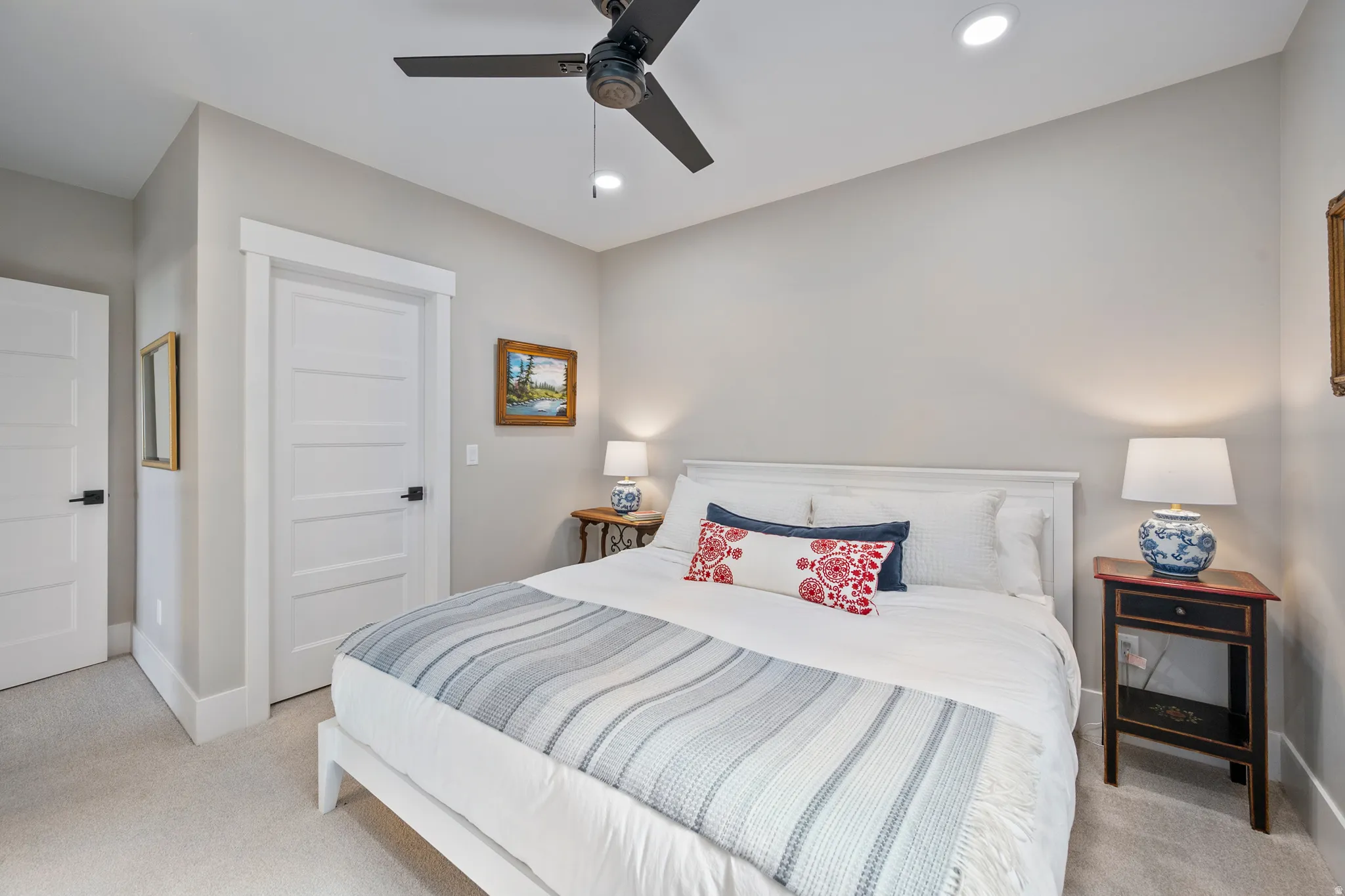 Bedroom featuring light gray walls, plush carpeting, a ceiling fan with integrated lighting, and recessed overhead lighting
