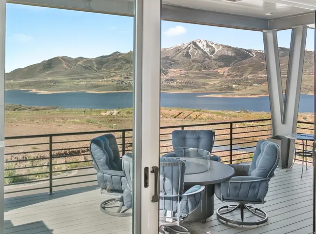 Expansive outdoor deck featuring a composite wood-finish surface and cable railing