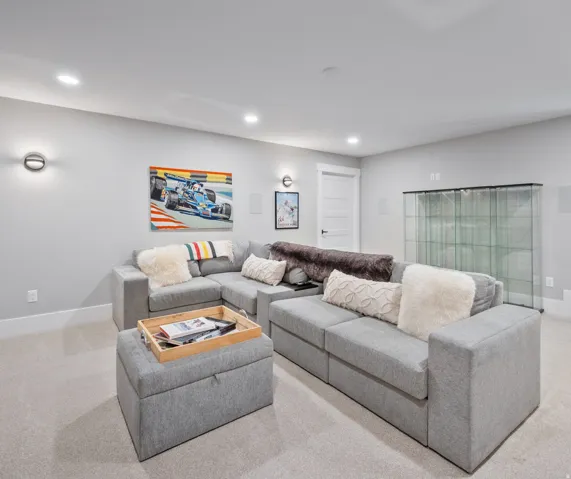 Recessed lighting illuminates the open-concept living area