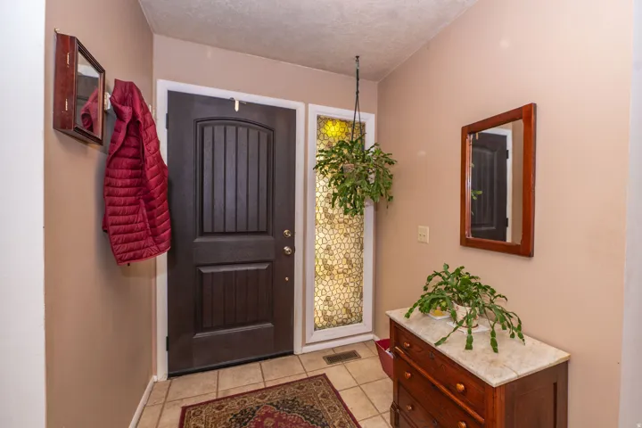 Entryway featuring tile flooring.