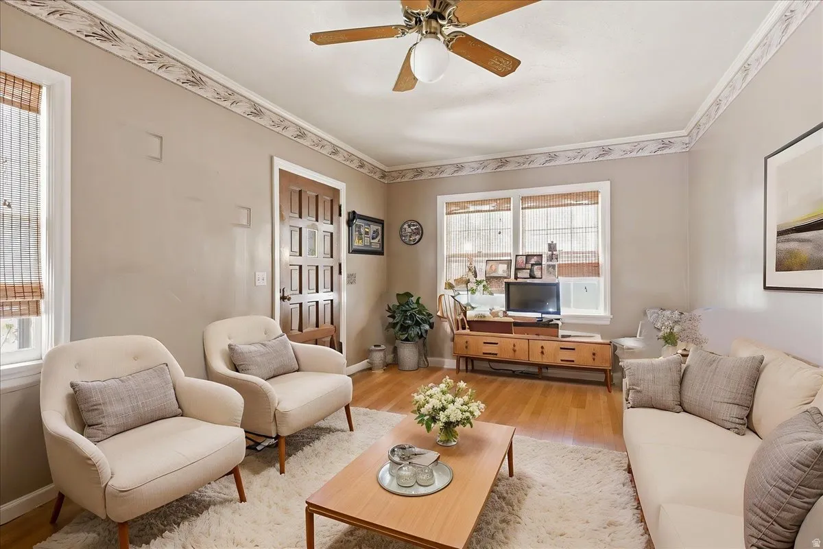 Living area featuring wood-finish flooring and light-toned walls