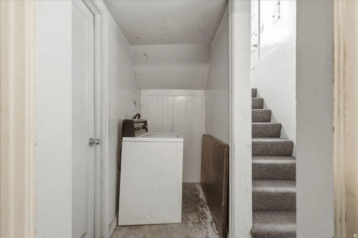 Laundry area with paneling details