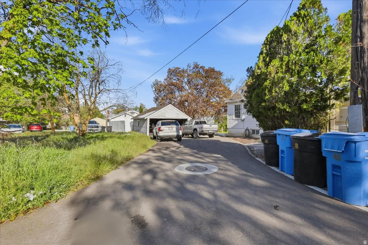 Paved driveway leading to a detached garage