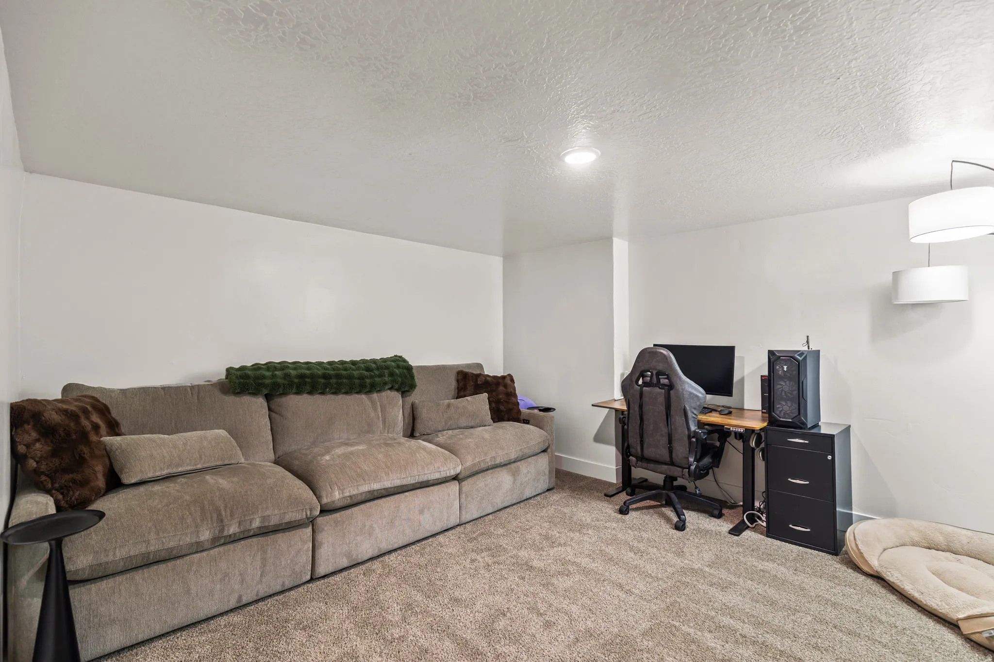 Light-colored carpeting throughout the space, complemented by crisp white walls