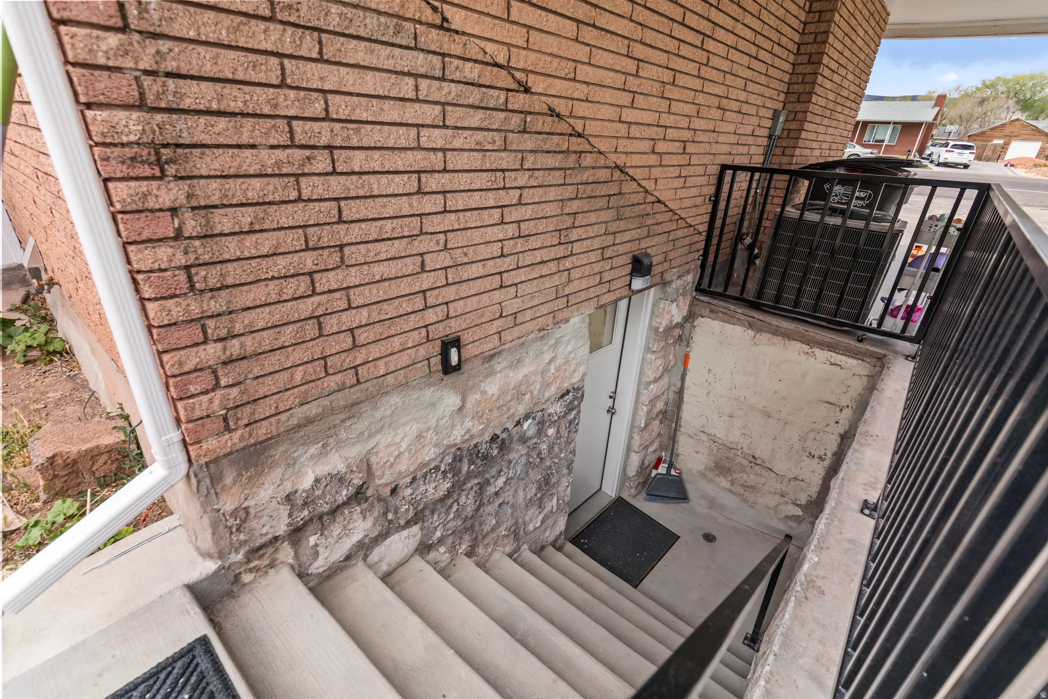 Concrete exterior stairs providing basement access