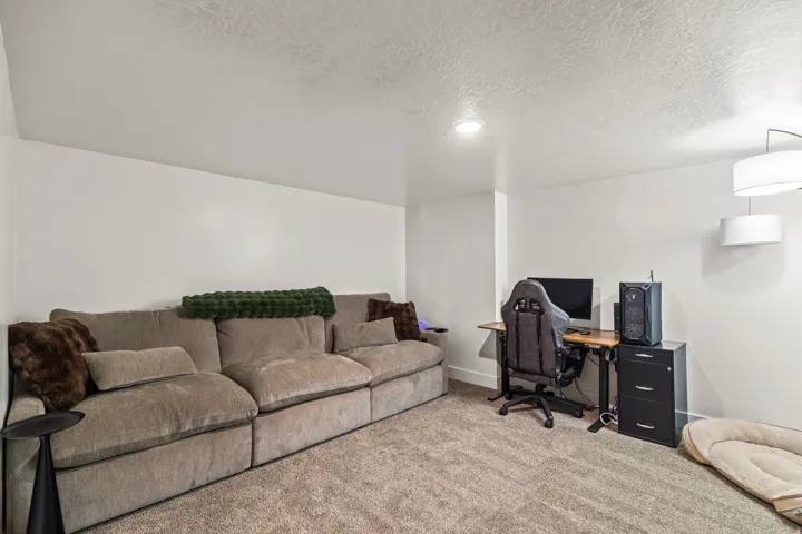 Light-colored carpeting throughout the space, complemented by crisp white walls