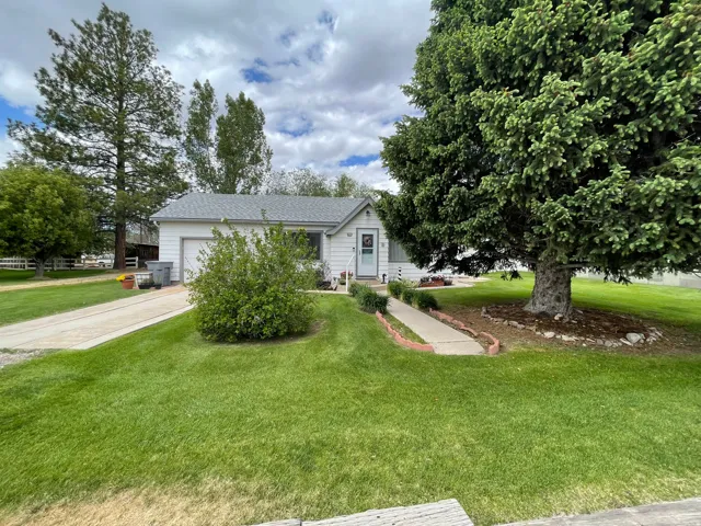 White single-story residence with an attached garage