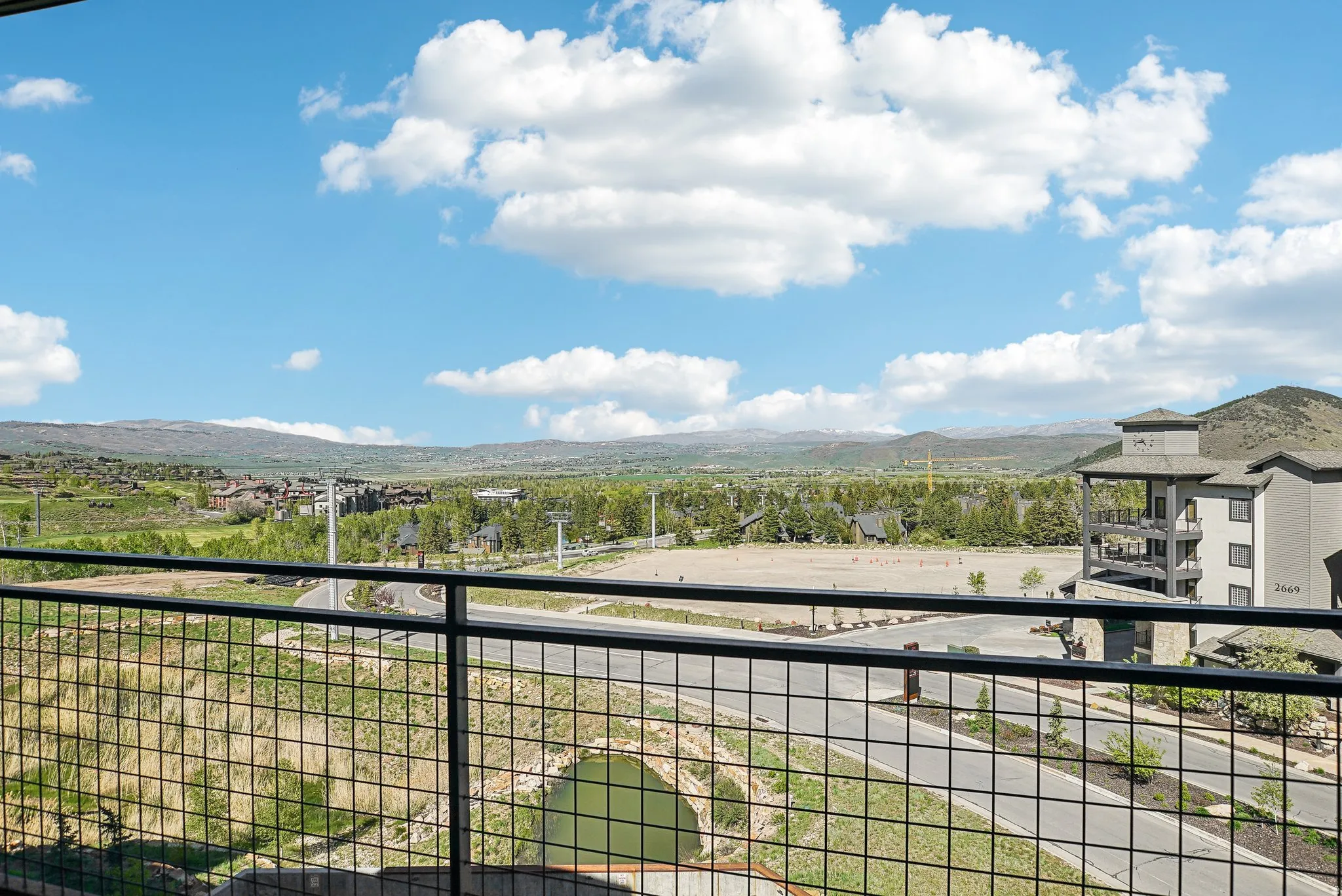 Expansive mountain and valley scenery from a private balcony