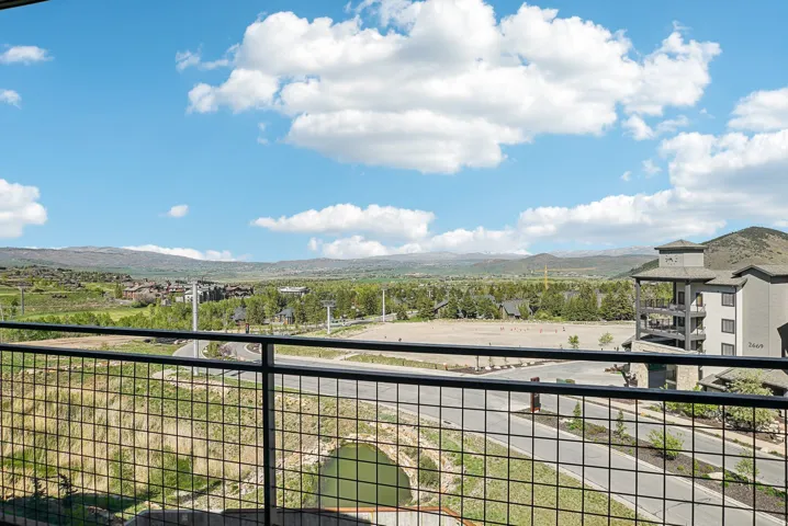 Expansive mountain and valley scenery from a private balcony