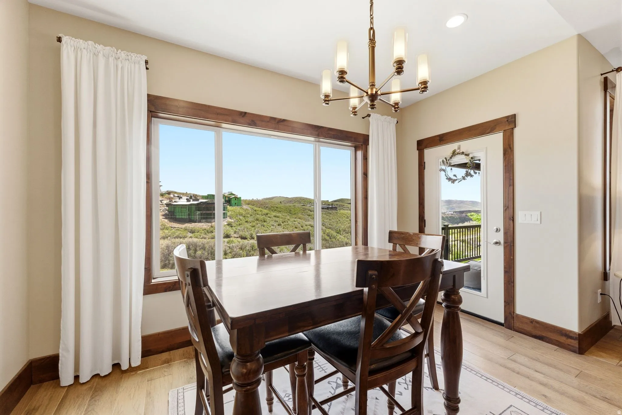 Dining area featuring a large picture window with extensive outdoor scenery