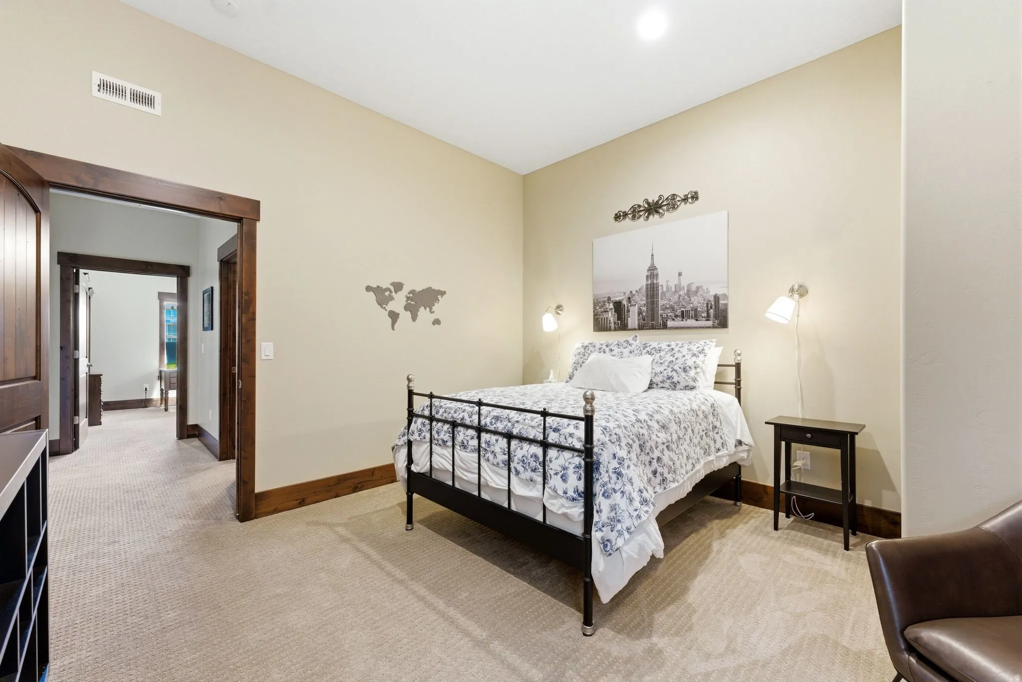 Carpeted room featuring a ceiling light fixture, recessed lighting, and a wall-mounted vent