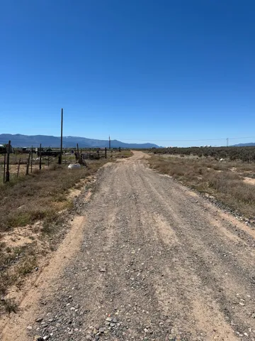 Gravel road winding through expansive arid terrain