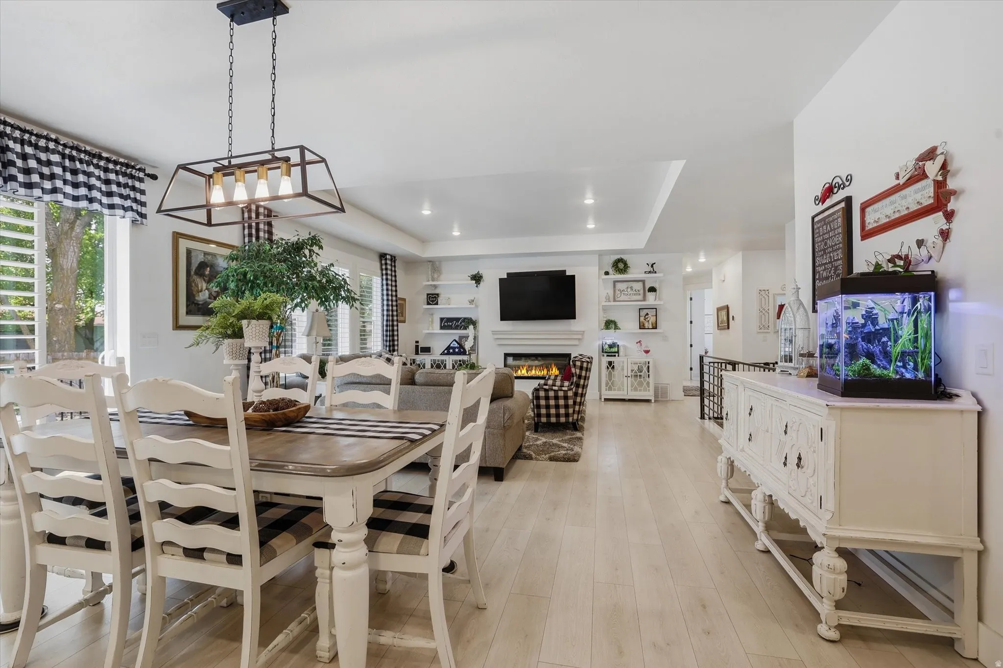 Open-concept living space featuring light wood-finish flooring throughout