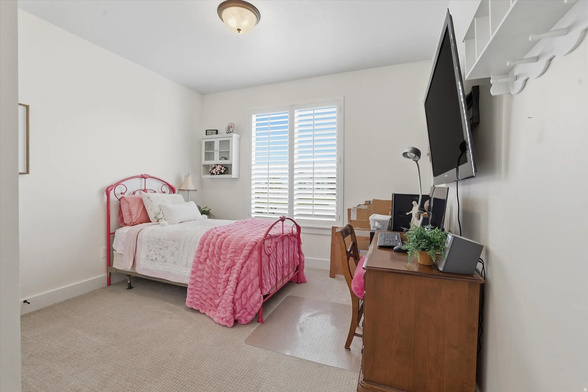 Bedroom featuring neutral wall paint and carpet flooring
