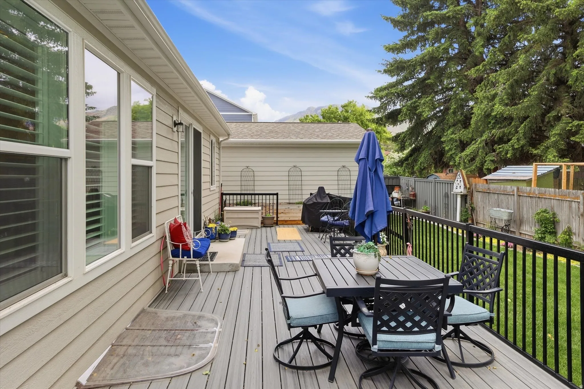 Expansive composite deck featuring black metal railings and ample space