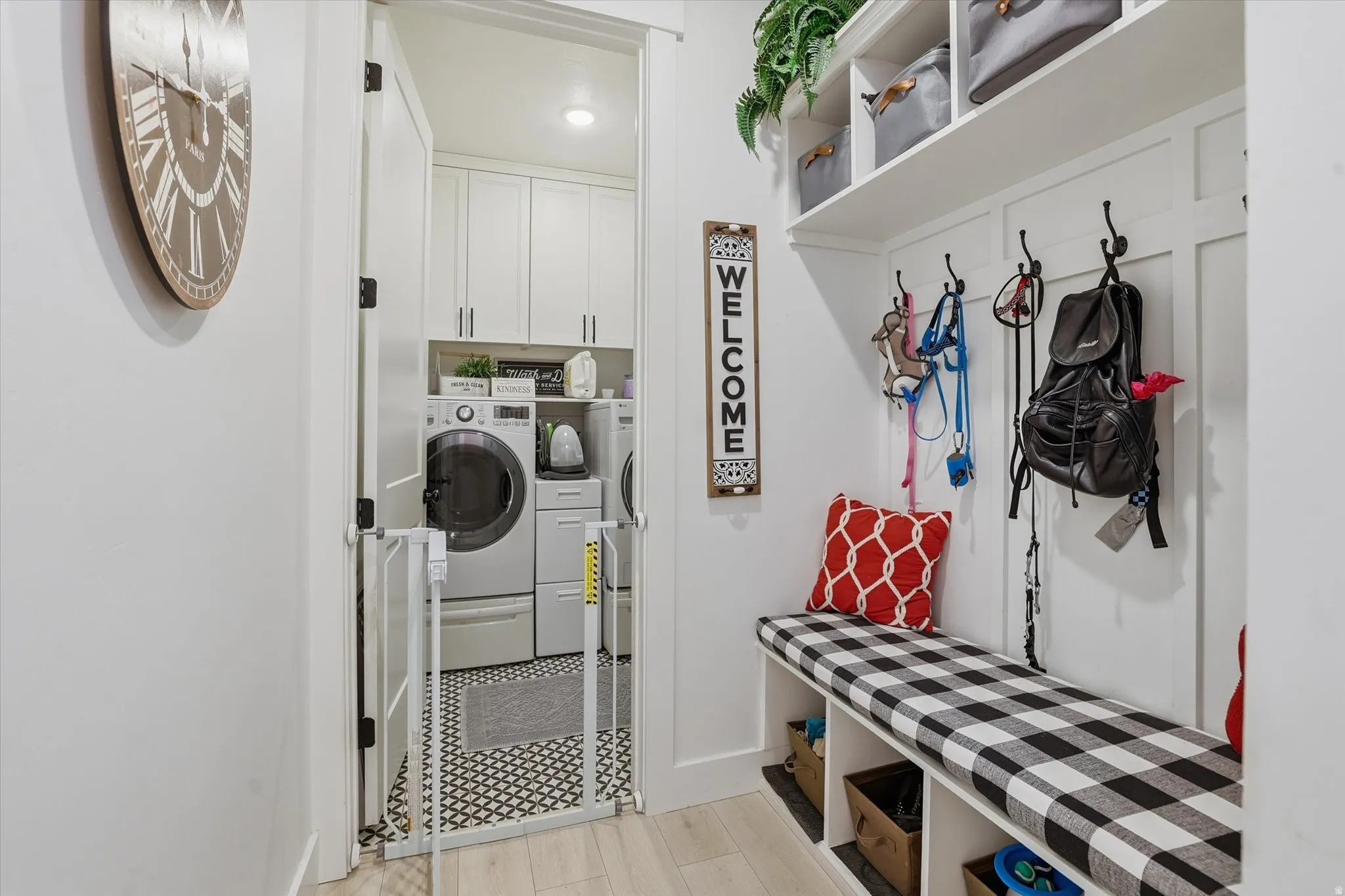 Integrated mudroom with built-in bench seating and storage cubbies