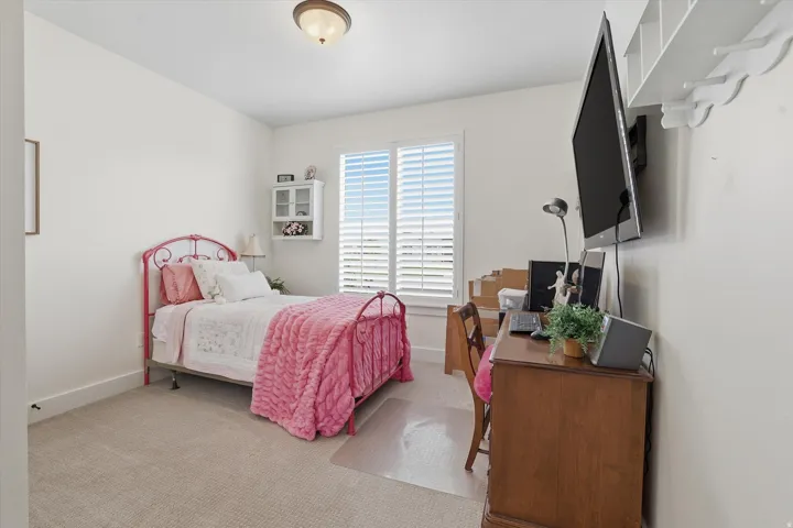 Bedroom featuring neutral wall paint and carpet flooring