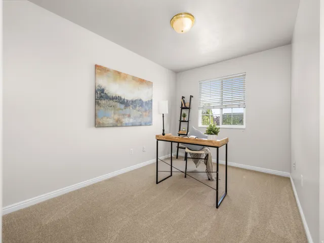 Room with light tan carpeting, a window with horizontal blinds, white baseboards, and a flush-mount ceiling light fixture