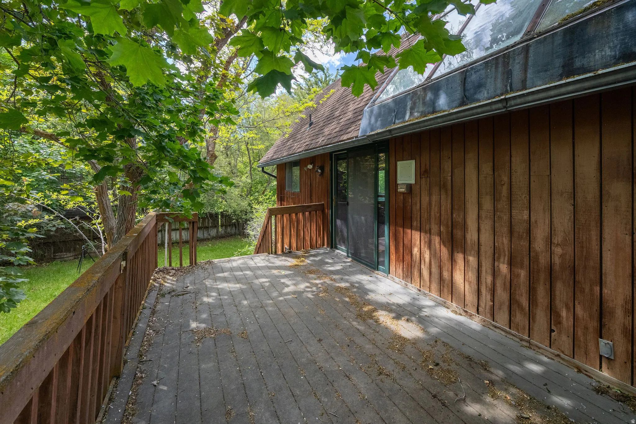 Expansive wood deck with wood plank flooring and matching railings