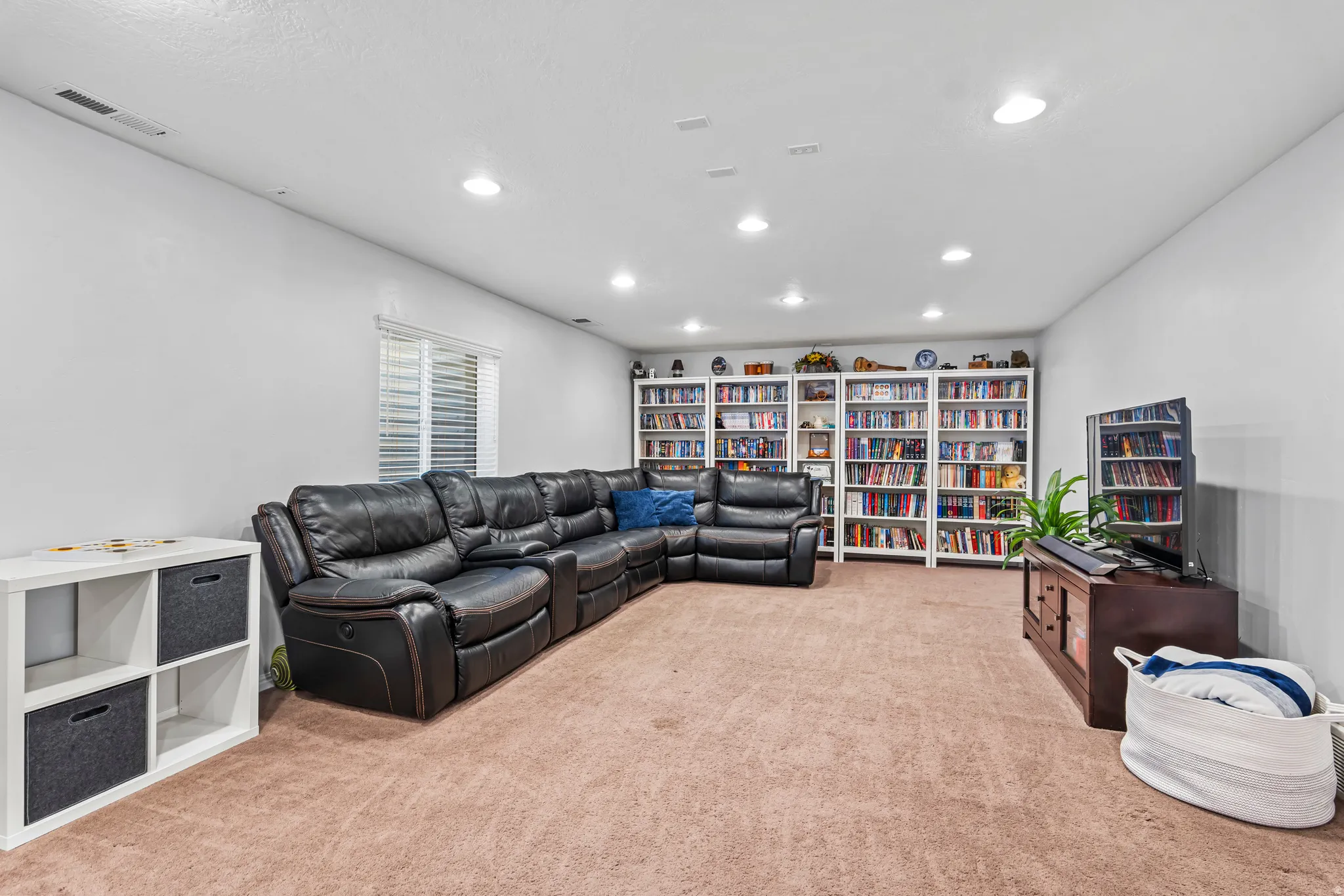 Spacious room featuring neutral