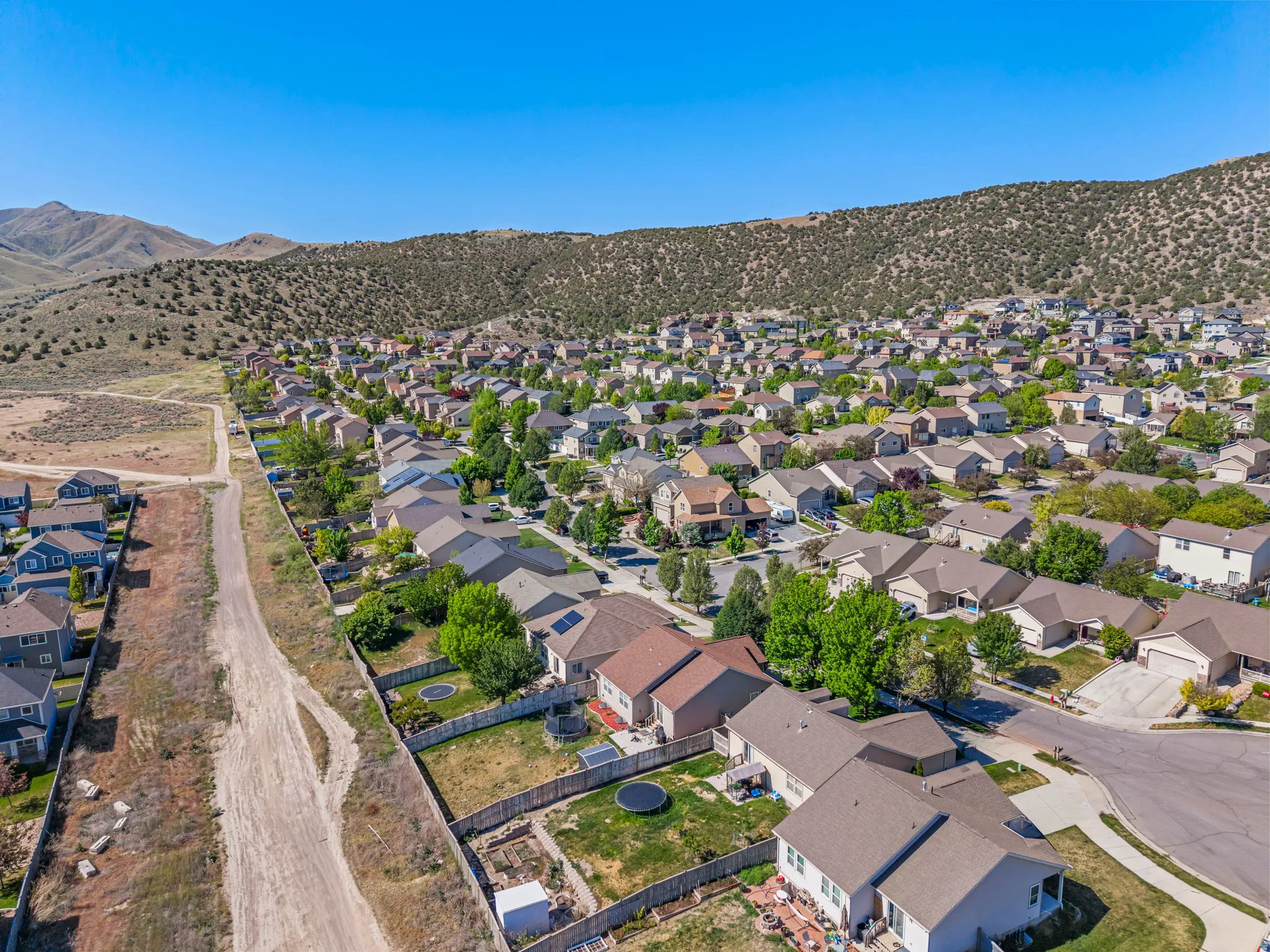 Residential community nestled against a natural hillside