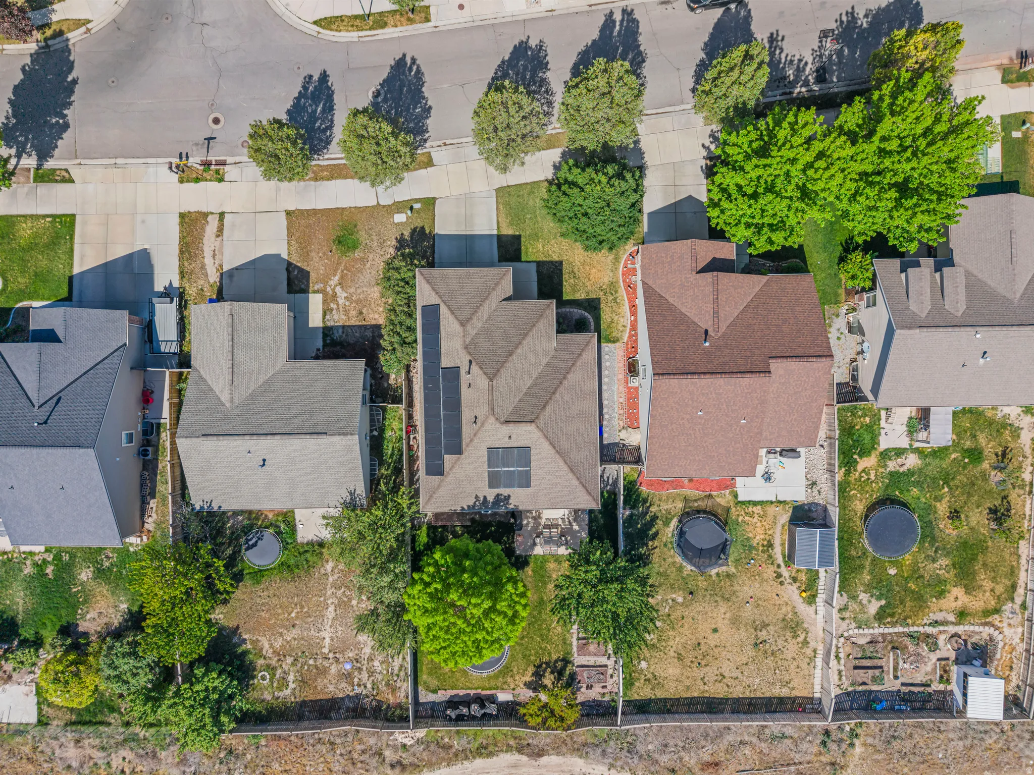 Aerial view showcasing the property's roofline with integrated solar panels