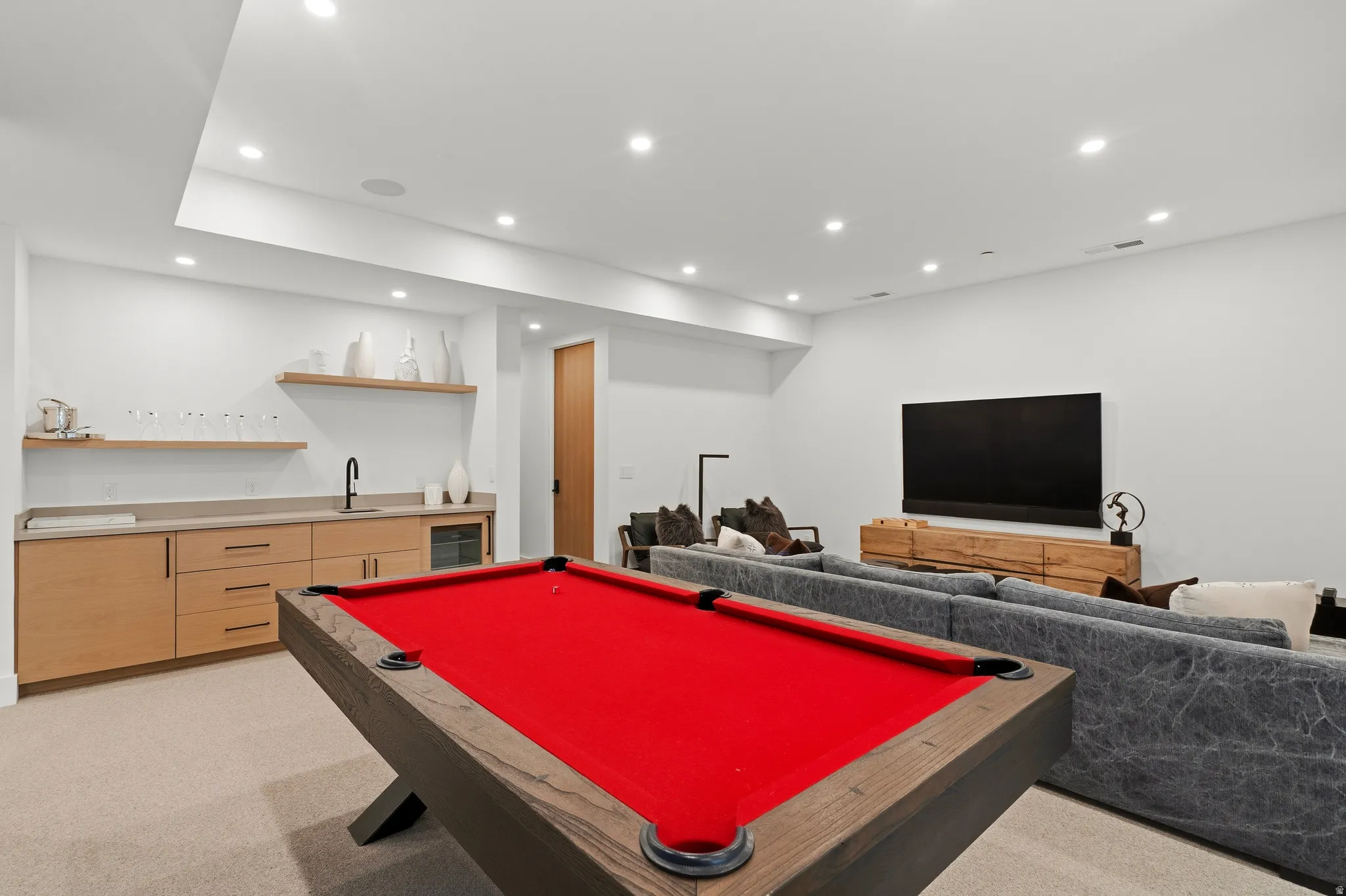 Entertainment room featuring pool table, sitting area, recessed lighting, and wet bar