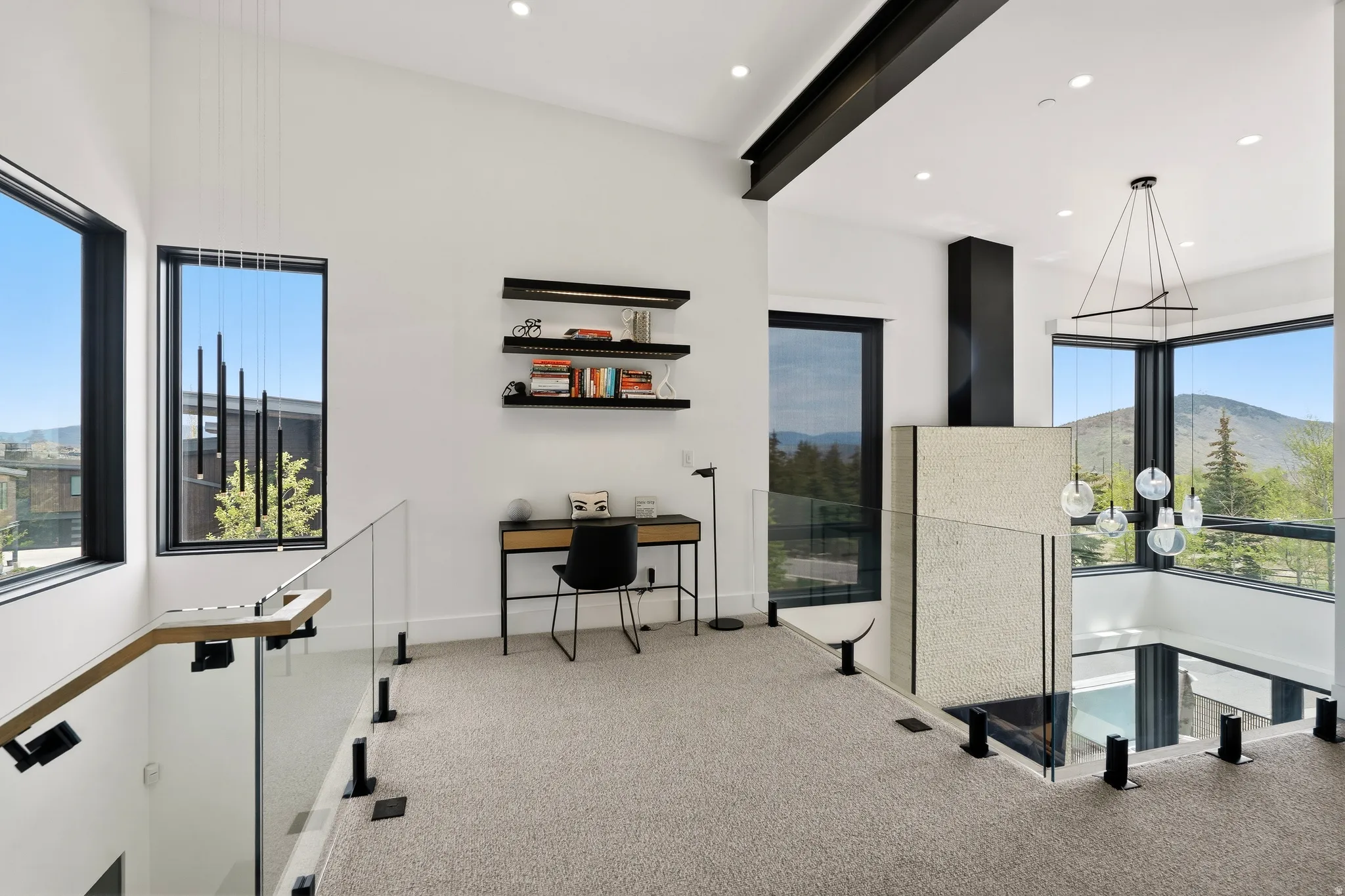 Open loft space with soaring ceilings and expansive windows