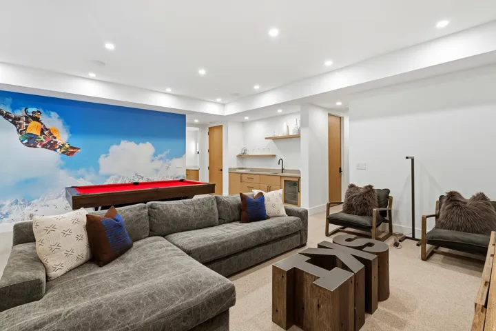 Entertainment room featuring pool table, sitting area, recessed lighting, and wet bar