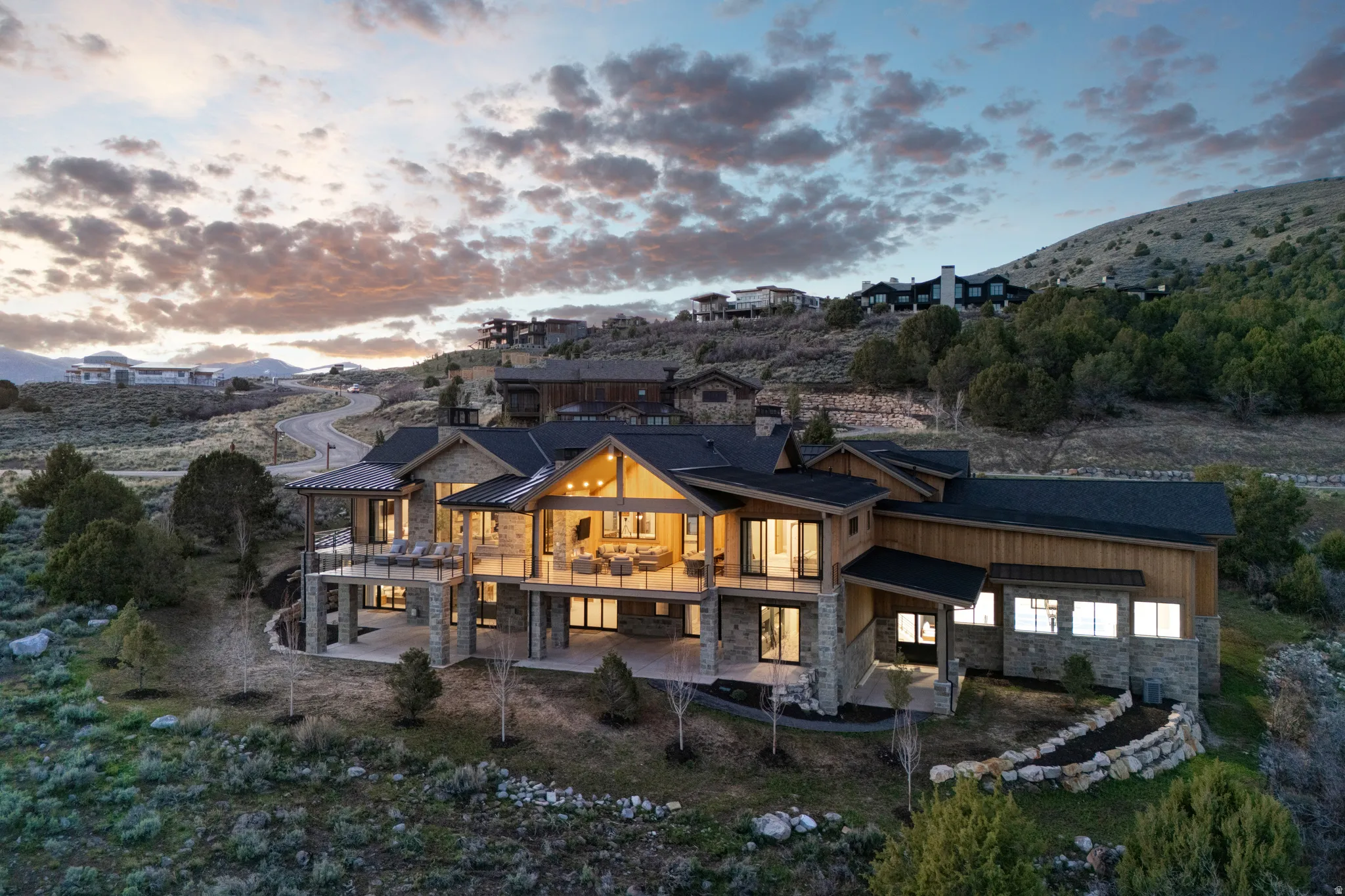 Contemporary mountain dwelling featuring stone and wood siding