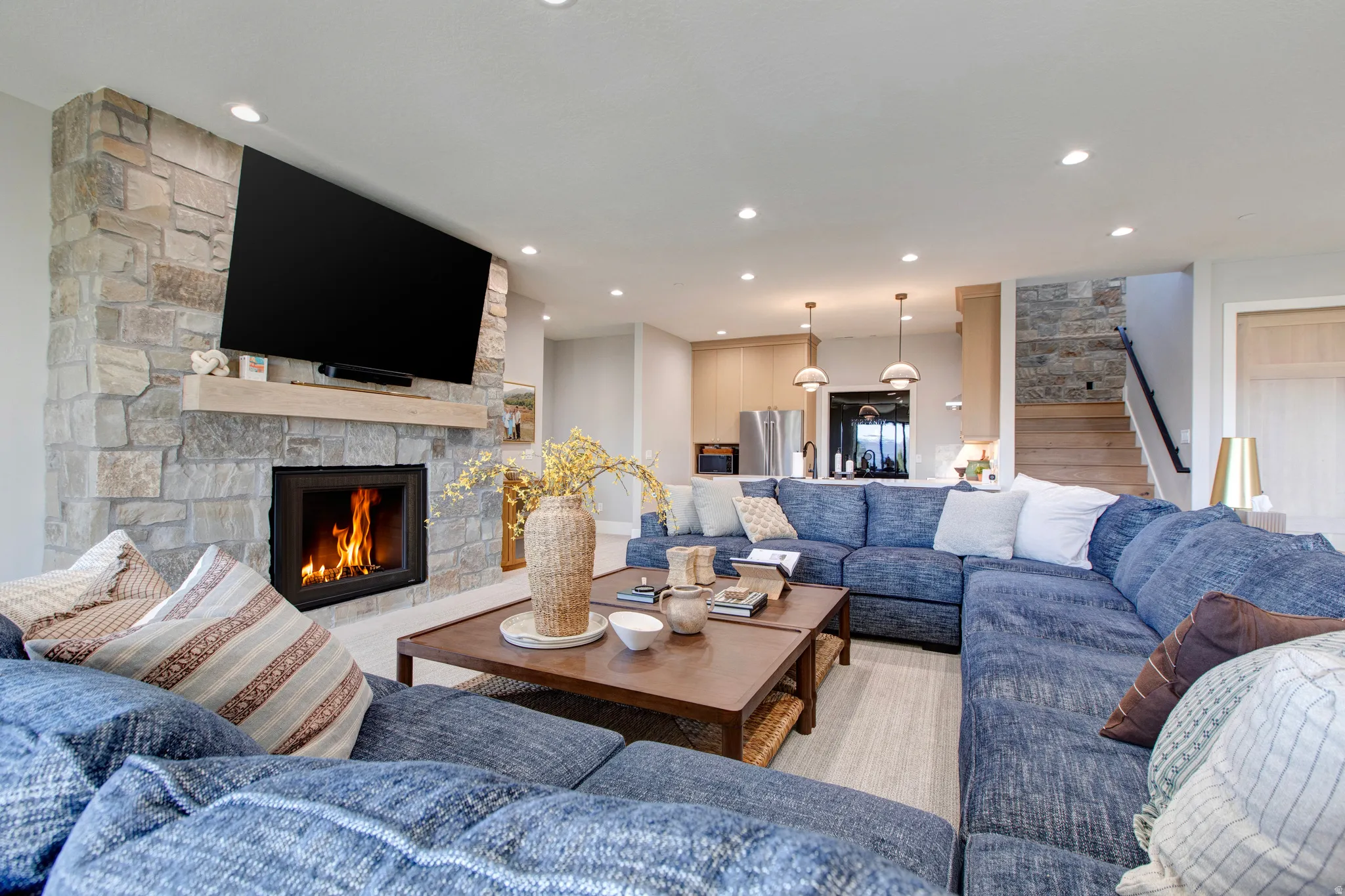 Stone-faced fireplace with a wood mantel