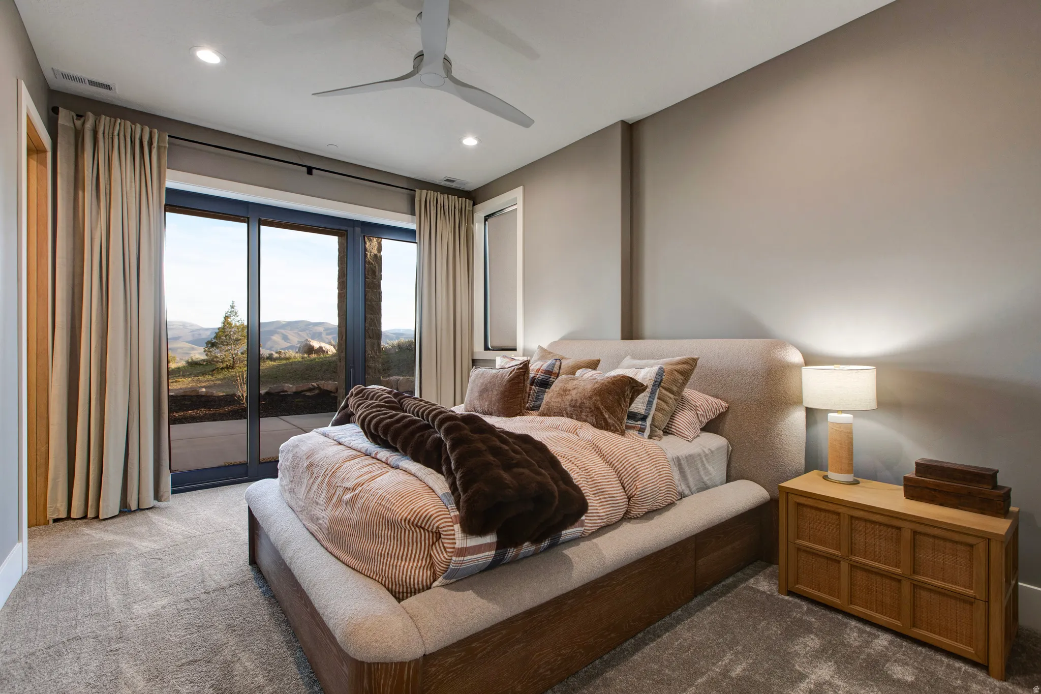 Bedroom featuring a full glass sliding door, recessed lighting, and a modern ceiling fan