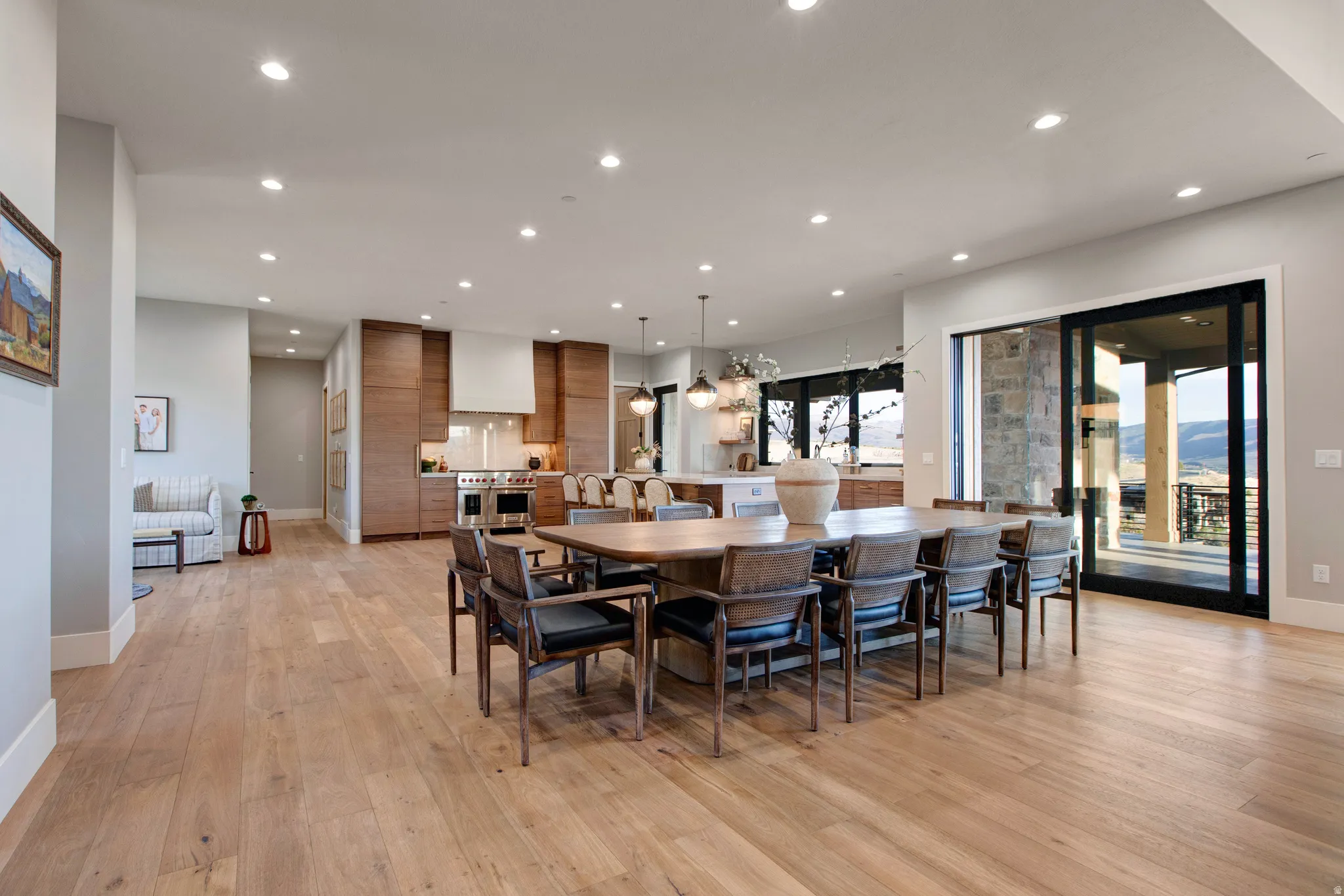 Open-concept main living area with wood-finish flooring throughout