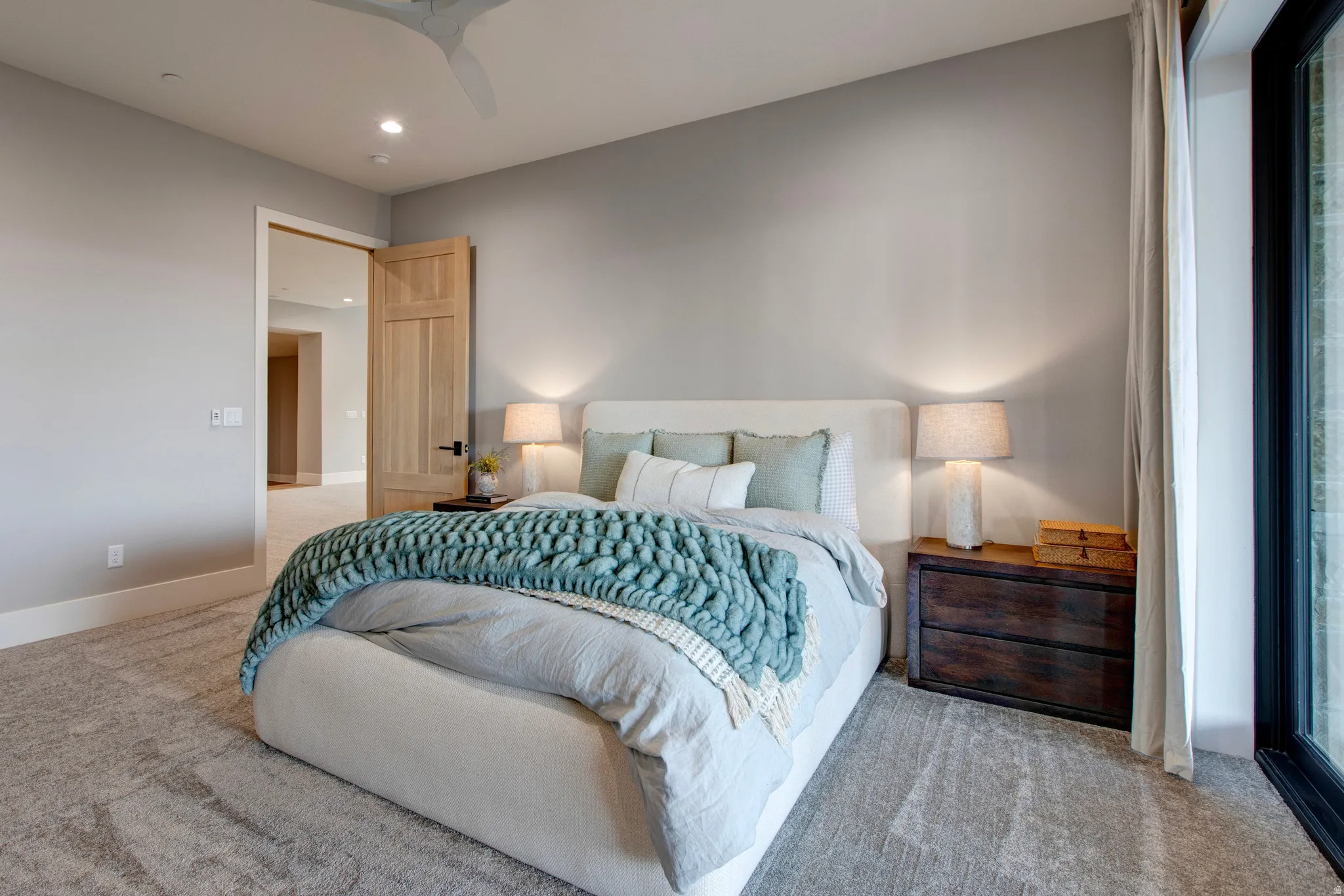 Plush carpeting throughout with a contemporary ceiling fan and recessed lighting