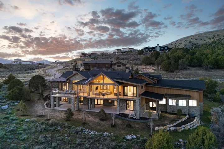 Contemporary mountain dwelling featuring stone and wood siding