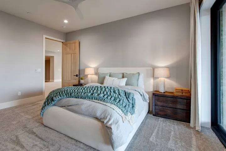 Plush carpeting throughout with a contemporary ceiling fan and recessed lighting