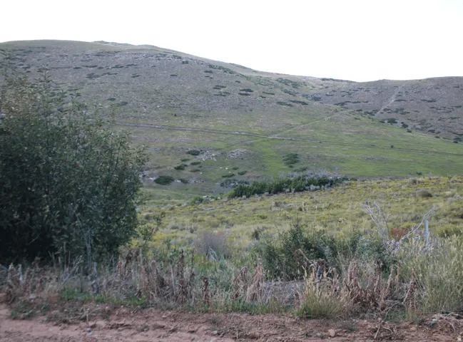 View of mountain background featuring rural landscape