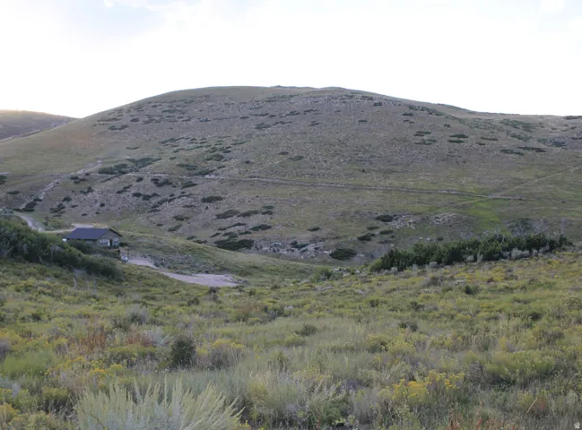 View of mountain background featuring rural landscape