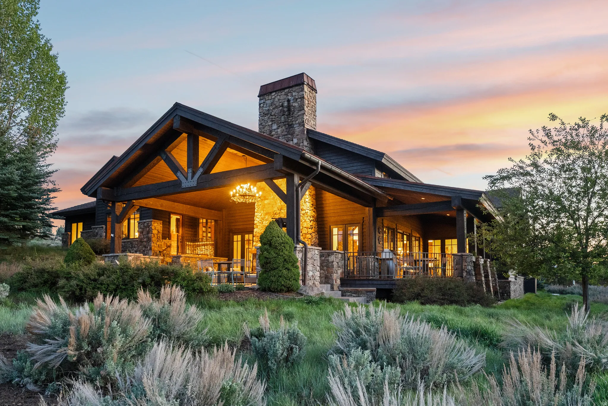 Craftsman-style exterior featuring a spacious covered porch with exposed timber framing