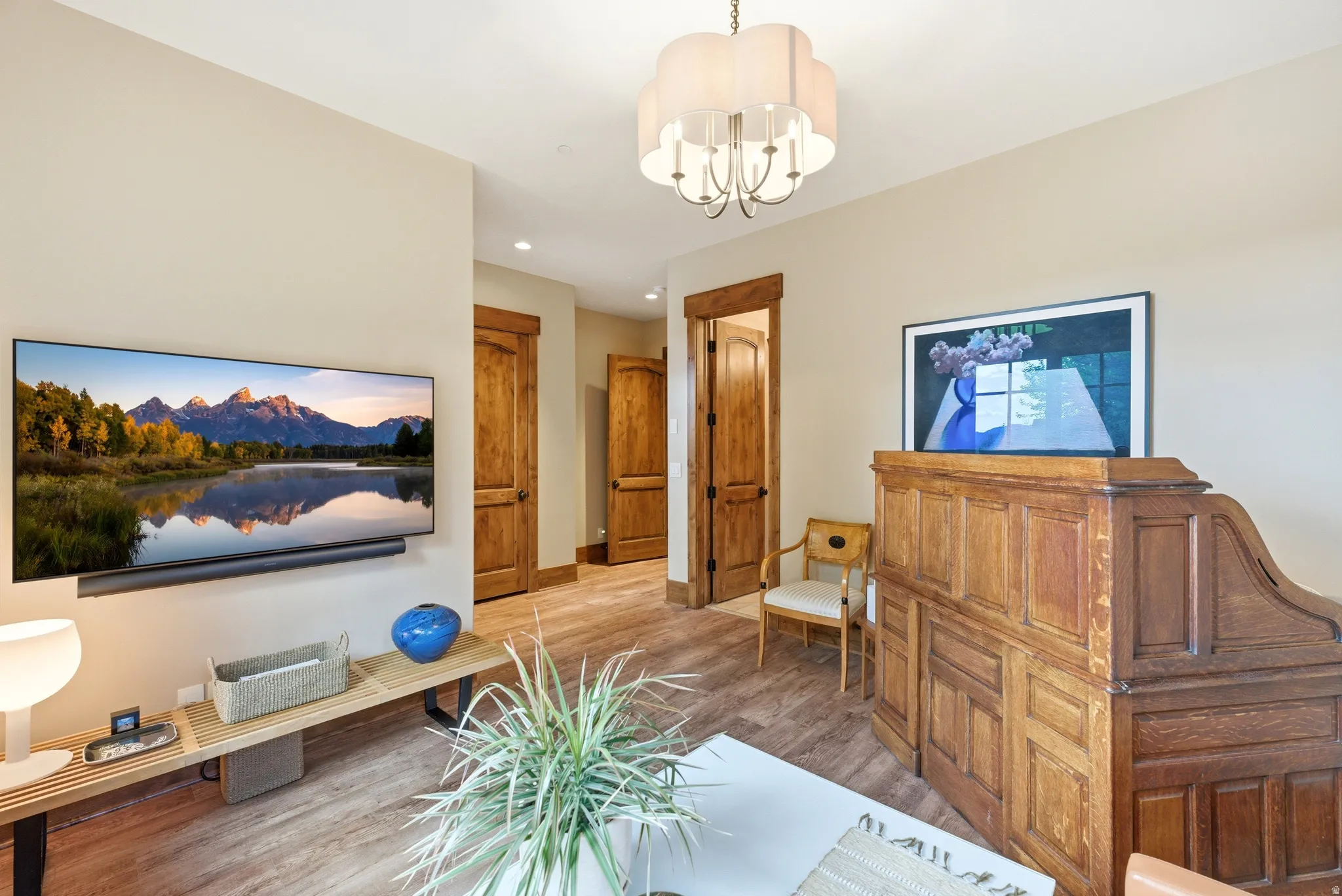 Warm wood-finish flooring complements the light-toned walls
